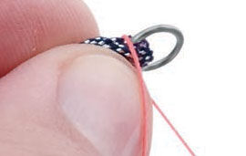 Wrapping thread around material under jump ring